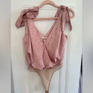 Bodysuit from boutique called ShopRiffRaff